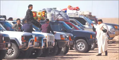  ?? Photo: Nampa/AFP ?? Libya tourism… Libyans gather as they take part in a 4x4 tourism trip in a desert area near al-Shuwayrif town, some 400 Km southwest of the capital, on December 3, 2020. In 2010, 110 000 foreign tourists visited Libya, generating $40 million, a figure that has dropped to zero since 2011 due to the political chaos and insecurity following the fall of the Moamer Kadhafi regime in 2011.