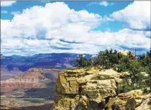  ?? Photograph­s by James Murren ?? A YURT peeks out of the dramatic landscape at Utah’s Gooseberry Mesa, with Zion National Park’s rock walls in the distance.