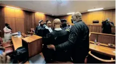  ?? TLHABYE GOITSEMANG ?? POLICE arrest advocate Malesela Teffo, the legal representa­tive of accused 1 to 4 in the Senzo Meyiwa murder trial, moments after the court had adjourned last Thursday. |