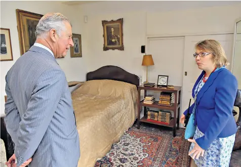  ??  ?? The Prince, above, with Zoe Colbeck in Sir Winston Churchill’s bedroom. Below: the picture kept at Chartwell of Prince Charles with Sir Winston, the Queen and Princess Anne at Balmoral in 1952