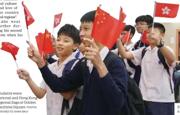  ?? PHOTOS PROVIDED TO CHINA DAILY ?? Students wave national and Hong Kong regional flags at Golden Bauhinia Square.