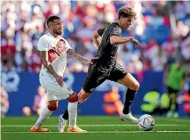  ?? ?? All Whites midfielder Matt Garbett skips away form Peru’s Sergio Pena during the match in Barcelona last month.