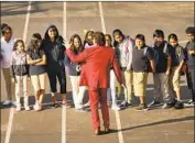  ?? Al Seib Los Angeles Times ?? A TEACHER at L.A.’s Dolores Huerta Elementary School entertains students on the first day of class.