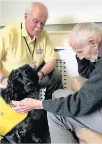  ??  ?? ●● Izzy and owner Kevin Hoines say hello to Jim Finch.