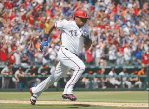  ?? The Associated Press ?? BELTING 3,000: Texas Rangers’ Adrian Beltre sprints around first to second after hitting for a double off a pitch from Baltimore Orioles’ Wade Miley in the fourth inning Sunday in Arlington, Texas. The double was Beltre’s 3,000th career hit.