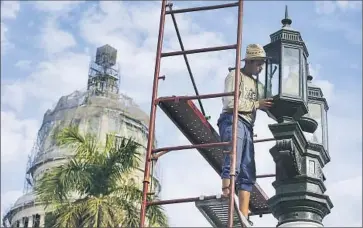  ?? Robert Gauthier
Los Angeles Times ?? STREET REPAIRS continue Friday in Old Havana, an area expected to be largely blocked off Sunday when President Obama takes a walking tour. Tourists have been moved out of central hotels.