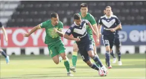  ??  ?? Action from the Melbourne Victory vs Beijing FC AFc Champions League Group E clash in Doha on Tuesday.