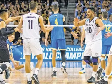  ?? Sean DuFrene Long Beach State ?? A SMILING Josh Tuaniga (10) and TJ DeFalco (11) helped the 49ers beat UCLA for the NCAA title last year.