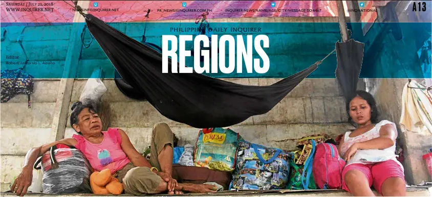  ?? —BARRY OHAYLAN ?? EXHAUSTED “Lumad” women rest in a gym after walking for seven hours to flee their communitie­s in the towns of San Agustin and Lianga, Surigao del Sur.