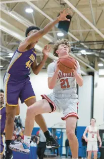  ?? DAVID GARRETT/SPECIAL TO THE MORNING CALL ?? Parkland’s Blake Nassry goes to the basket defended by Roman Catholic’s Shareef Jackson in a PIAA Class 6A quarterfin­al game Saturday at Norristown High School.