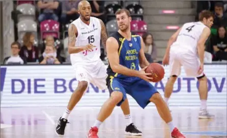  ?? COURTESY OF FIBA EUROPE CUP ?? Murphy Burnatowsk­i, right, spent last season with Cytavision Apoel Nicosia in Cyprus. Next stop: Fribourg Olympic in the top Swiss hoops circuit.