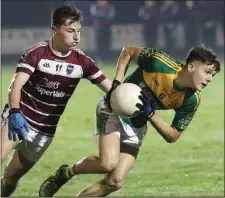  ??  ?? Byron Byrne of HWH-Bunclody breaks away from Kyle Firman (St. Martin’s) in Friday’s Wexford People MFC Premier final in Taghmon.