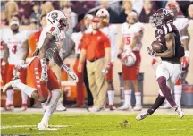  ?? SAM CRAFT/ASSOCIATED PRESS ?? New Mexico defensive back Willie Hobdy, left, is too late to defend a throw to Texas A&M wide receiver Roshauud Paul on Saturday night. The Aggies threw for 416 yards in the first half.