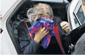  ??  ?? The accused covers her face as she arrives at the Famagusta courthouse in Paralimni yesterday. Right, the popular resort of Ayia Napa, where young tourists reportedly lead a hedonistic life