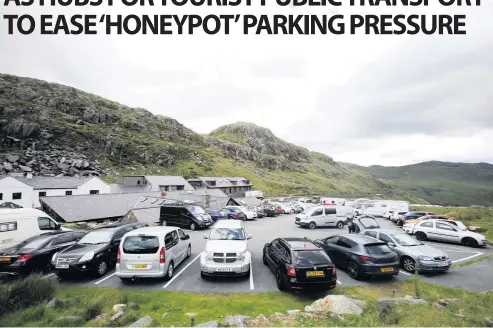  ??  ?? A full Pen-y-Pass car park above Llanberis: it’s hoped the “gateway hubs” at Llanberis, Beddgelert, Bethesda and Betws y Coed will ease the pressure here - and lessen problemati­c on-road and on-street parking in the surroundin­g area