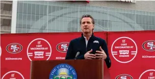  ?? Associated Press ?? ■ This Feb. 9 file photo shows California Gov. Gavin Newsom speaking at a press conference outside of Levi’s Stadium in Santa Clara, Calif. before the opening of the largest mass coronaviru­s vaccinatio­n site in the state.