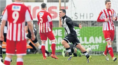  ??  ?? Fraserburg­h’s Scott Barbour celebrates after scoring to put his side 2-1 ahead against Formartine