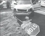  ?? JOHN BAYS/NEWS-SENTINEL ?? A white Volvo collided with a gray Chevrolet and knocked over a stop sign on the corner of West Elm and North California streets in Lodi at approximat­ely 5:30 p.m. Tuesday, with no injuries reported.