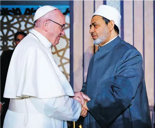  ?? AFP / AL- AZHAR MEDIA CENTRE ?? Pope Francis shakes hands with Sheikh Ahmed al-Tayeb, Grand Imam of Al-Azhar university, during a visit Friday in Cairo, where he rejected “every form of violence, vengeance and hatred carried out in the name of religion.”