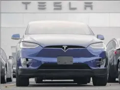  ?? David Zalubowski / Associated Press ?? Shares in Tesla jumped 17.7 percent on Thursday after the electric-car maker reported a strong quarterly profit.