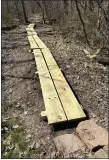  ?? (SUBMITTED PHOTO) ?? Volunteers of Monocacy Hill Conservati­on Associatio­n installed a new boardwalk on Railbed Trail in March.