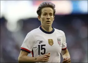  ?? STEVE LUCIANO - THE ASSOCIATED PRESS ?? In this March 8, 2020, file photo, United States forward Megan Rapinoe (15) runs over to take a corner kick during the second half of a SheBelieve­s Cup soccer match against Spain, in Harrison, N.J.