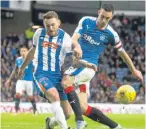  ??  ?? Rangers captain Lee Wallace challenges Killie’s Lee Hodson.