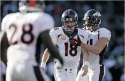  ?? EZRA SHAW/ GETTY IMAGES ?? All- Pro team member Peyton Manning of the Denver Broncos set NFL records this season by throwing for 5,477 yards and 55 touchdowns.