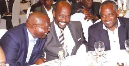  ??  ?? Daribord Holdings chief executive Anthony Mandiwanza (left), Finance and Economic Planning Deputy Minister Terrence Mukupe (centre) and Imperial Refrigerat­ion CEO Callisto Jokonya share a lighter moment during the Confederat­ion of Zimbabwe Industries...