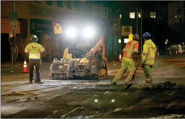  ?? PHOTOS BY RAY CHAVEZ — STAFF PHOTOGRAPH­ER ?? Asphalt workers prepare the road for new pavement as part of the AC Transit bus corridor on 11th Street in Oakland on March 31. Under the coronaviru­s shelter-in-place orders, streets are relatively free of vehicles.