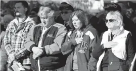  ?? CAPITAL GAZETTE FILE ?? People pay their respects during a Veterans Day service at the Linthicum Veterans Memorial.