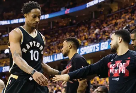  ?? JASON MILLER/GETTY IMAGES ?? Raptor DeMar DeRozan checks out in the second half of Wednesday night’s Game 2 loss to the Cavs after an ugly five-point performanc­e.