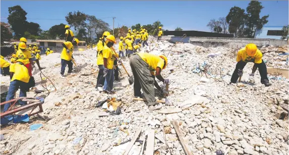  ?? THONY BELIZAIRE/AFP/GETTY IMAGES ?? A massive earthquake in Haiti back in 2010 killed hundreds of thousands of people and destroyed infrastruc­ture throughout the Caribbean country.