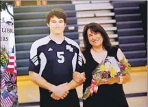  ??  ?? JONN FLATH, 18, shown with his mother, Ana, died unexpected­ly in 2011, but the coroner was unable to determine the cause.