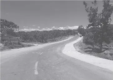  ?? ?? Photo shows the concreting of the road connecting the barangays of Calaya and San Antonio in Nueva Valencia town. It is one of the road projects of the Department of Public Works and Highways in the island province of Guimaras.