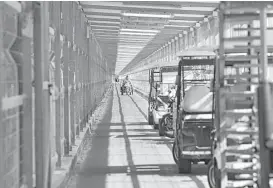  ?? Adel Hana / Associated Press ?? Passengers arrive Wednesday via a tunnel from Israel to the Palestinia­n side of the Erez checkpoint between Israel and Gaza.