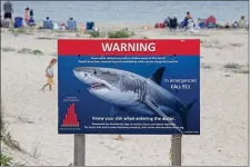  ?? STUART CAHILL — BOSTON HERALD ?? Shark warning signs are sure to return at Lighthouse Beach in Chatham.