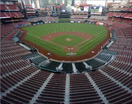  ?? JEFF ROBERSON ?? FILE - In this July 24, 2020, file photo, empty seats are viewed in Busch Stadium as St. Louis Cardinals starting pitcher Jack Flaherty throws in the first inning baseball game against the Pittsburgh Pirates in St. Louis. Major League Baseball players rejected a proposal to delay the start of spring training and the season due to the coronaviru­s pandemic, vowing Monday, Feb. 1, 2021, to report under the original schedule.