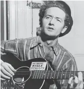  ?? Al Aumuller / Associated Press 1943 ?? Folk singer Woody Guthrie captured the idea of America in his songs.