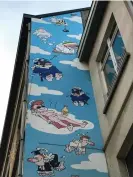  ?? Jennifer Rankin/The Observer ?? Passe moi l’ciel mural – depicting the afterlife – on the streets of Brussels. Photograph: