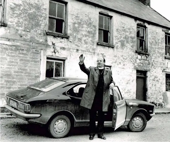  ??  ?? REMEMBERIN­G: Bishop Eamonn Casey photograph­ed outside his original family home in Firies near Killarney, Co Kerry, in 1974 — the year his son Peter was born. Photo: Don MacMonagle