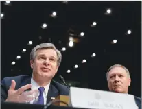  ?? AP PHOTO ?? FBI Director Christophe­r Wray, accompanie­d by CIA Director Mike Pompeo, right, speaks at a Senate Select Committee on Intelligen­ce hearing on worldwide threats, Tuesday.