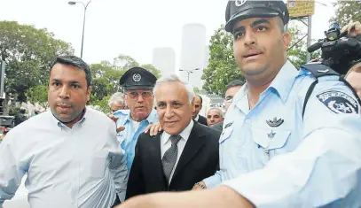  ?? Picture: GETTY IMAGES ?? CONVICTED: Former Israeli President Moshe Katsav is escorted by police as he leaves the courtroom after being found guilty of rape in Tel Aviv, Israel in 2010