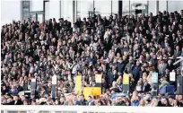  ??  ?? NO LET-UP Racegoers in the Uttoxeter stands yesterday