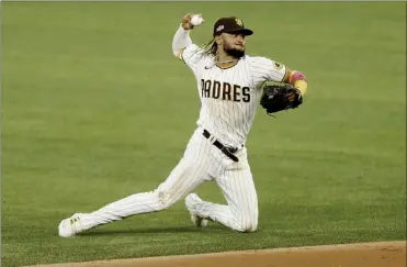  ?? TNS ?? Fernandota­tis Jr. of the San Diego Padres tries to throw out Corey Seager of the Los Angeles Dodgers in the 3rd inning during Game 3 of the NLDS at Globe Life Field in Arlington,texas on, Oct. 8, 2020.