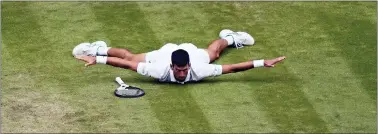  ?? ALBERTO PEZZALI — THE ASSOCIATED PRESS ?? Novak Djokovic reacts after hitting a cross-court passing shot against Jannik Sinner in the fifth set on Tuesday.