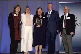  ?? PHELAN M. EBENHACK/SPECIAL TO THE SENTINEL ?? Rev. Mary Lee Downey, center, founder of the Community Hope Center, stands with Orlando Sentinel Editor-in-Chief Julie Anderson, from left, Publisher Nancy Meyer, Columnist Scott Maxwell and Opinion Editor Mike Lafferty.