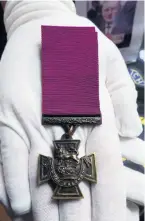  ??  ?? &gt; The Victoria Cross medal