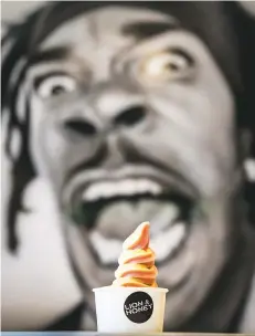  ??  ?? A portrait of Busta Rhymes behind a soft-serve swirl.