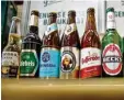  ?? Foto: Daniel Karmann, dpa ?? Der Konzern AB InBev braut viele be kannte Biere.